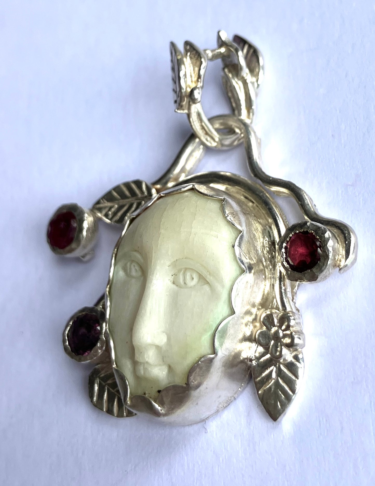 Face Pendant in Carved Bone With Silver & Red Garnet