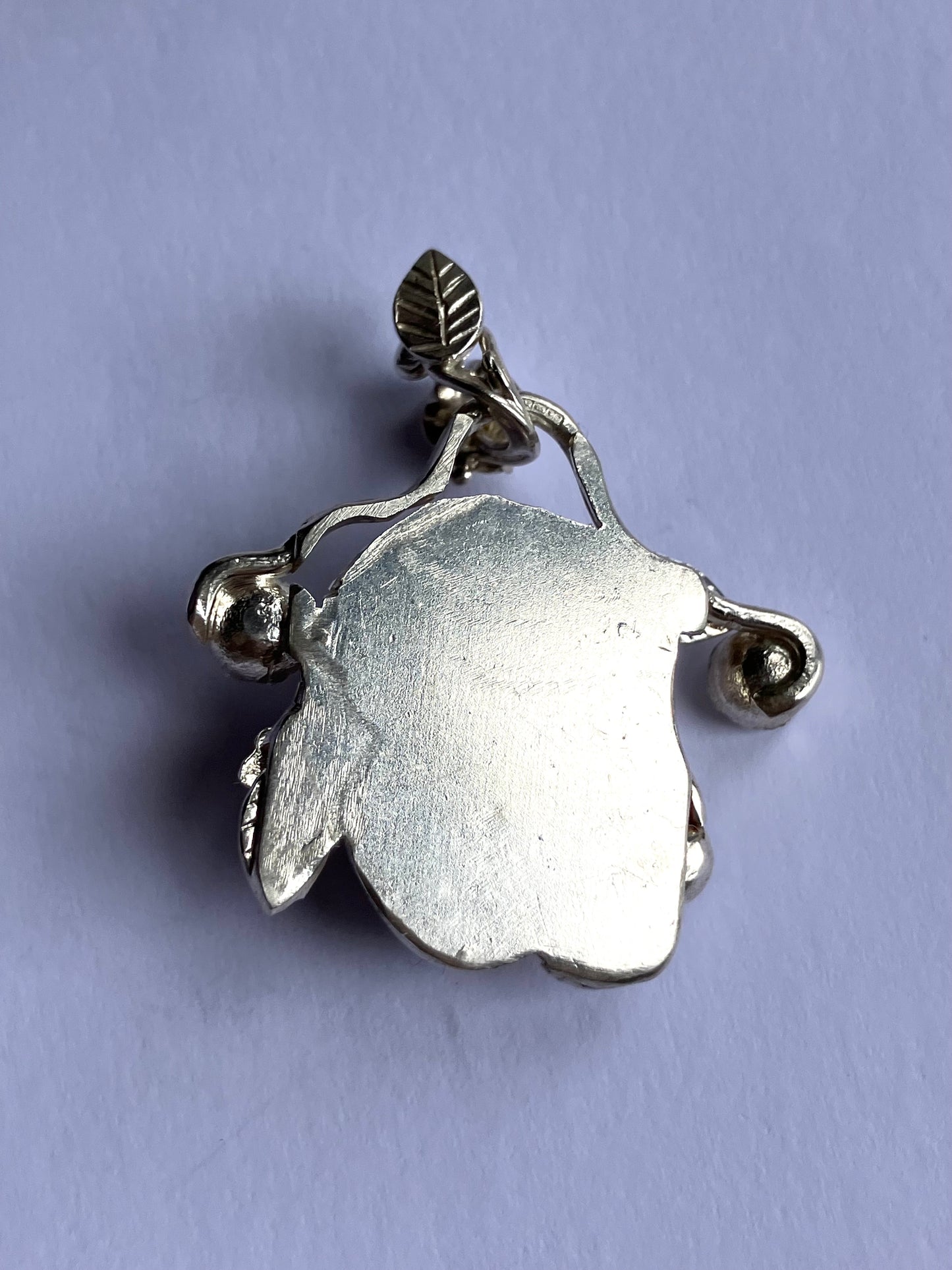 Face Pendant in Carved Bone With Silver & Red Garnet