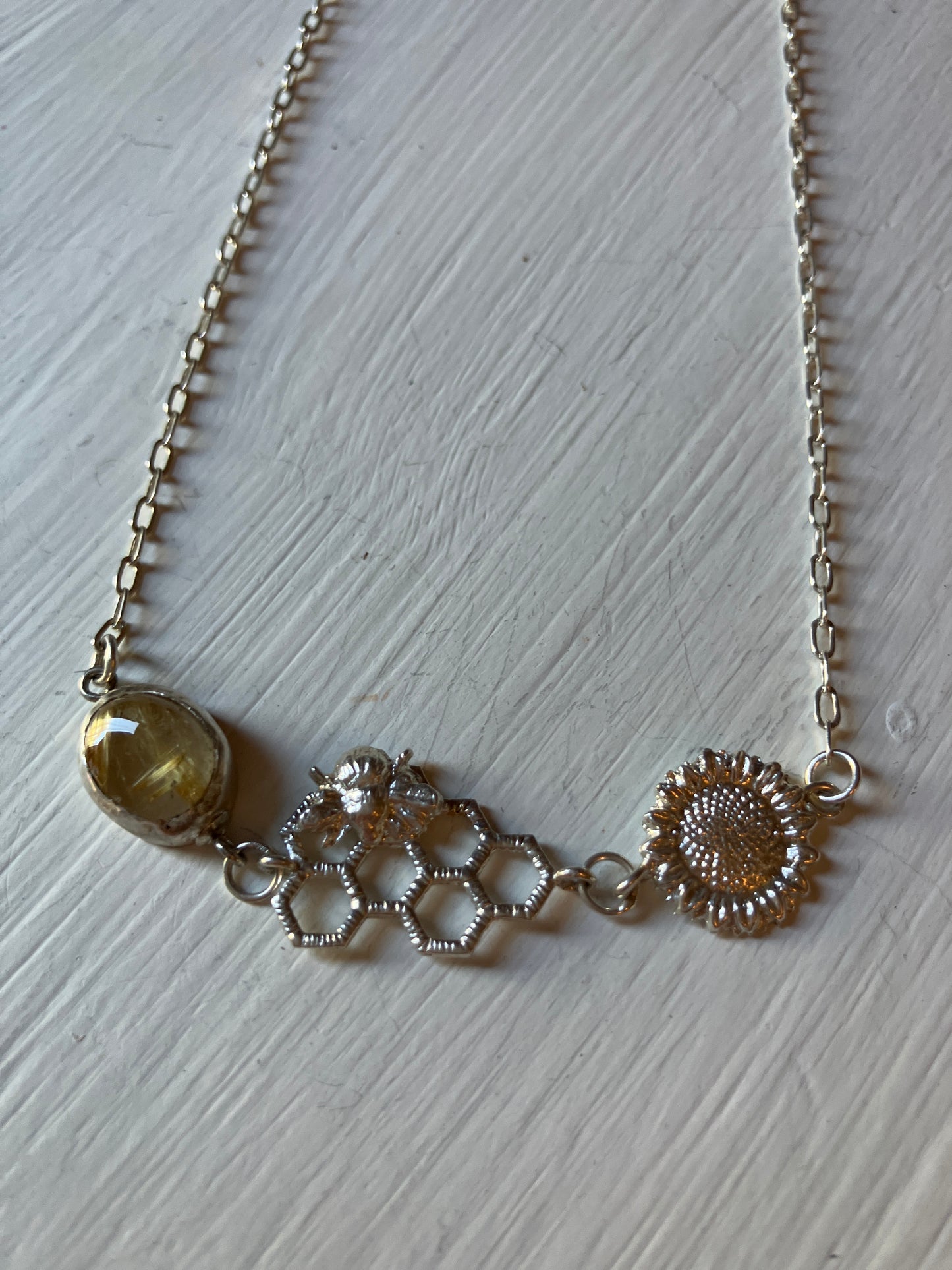 Silver Bee on open honeycomb necklace with Sunflower