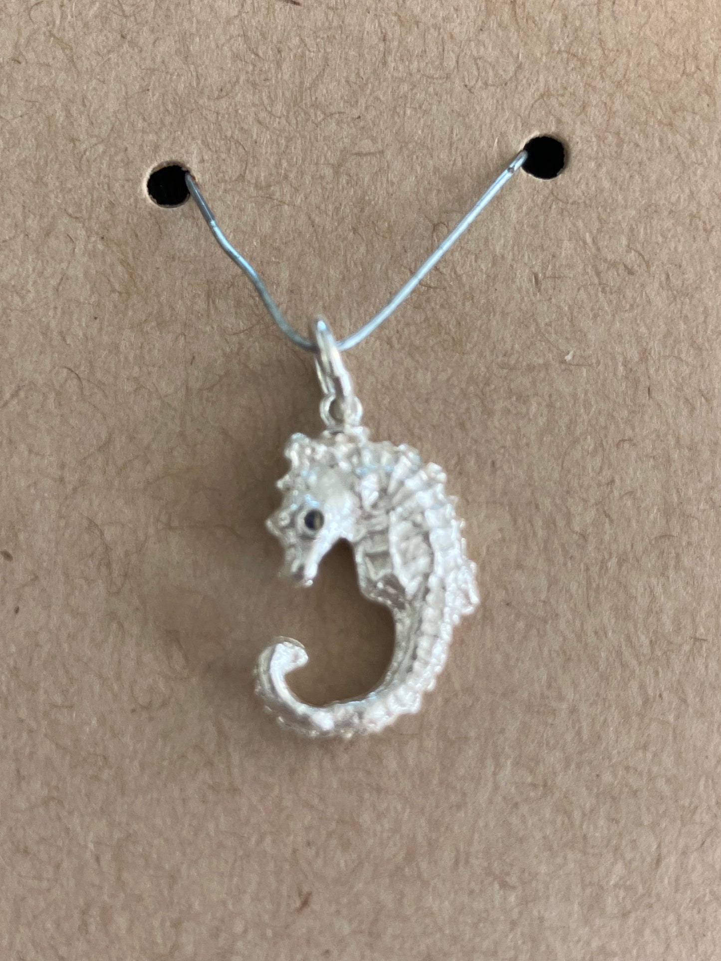 Small Silver Seahorse pendant with sapphire eyes