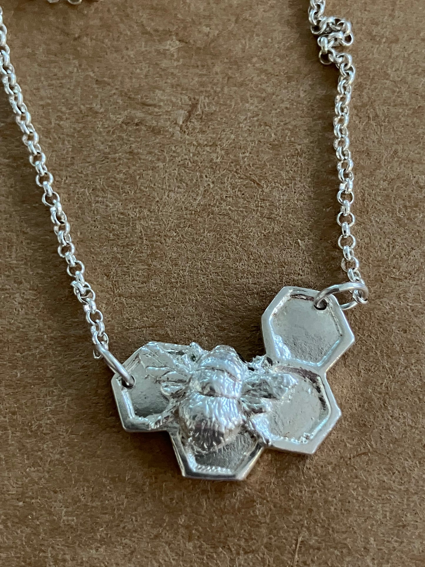 Silver Bee on solid honeycomb necklace