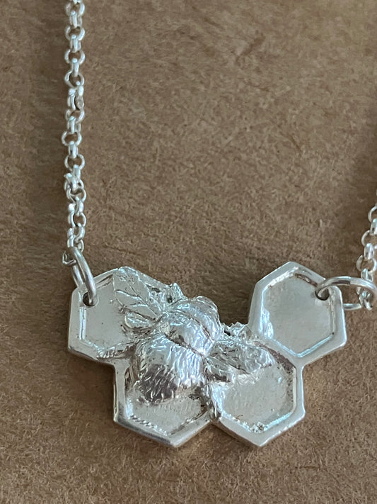 Silver Bee on solid honeycomb necklace