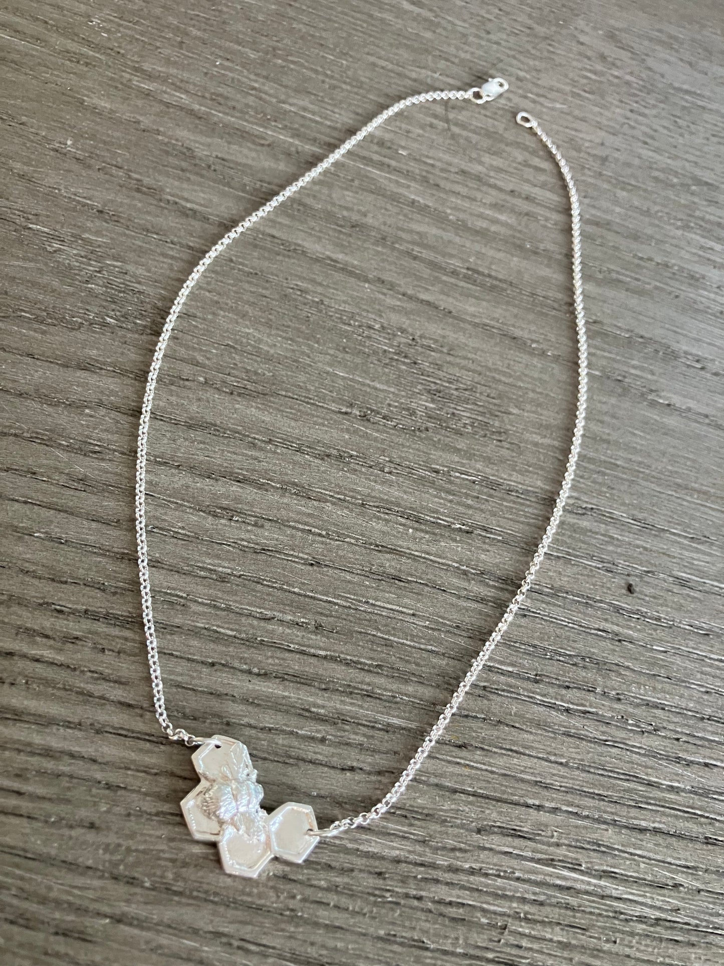 Silver Bee on solid honeycomb necklace