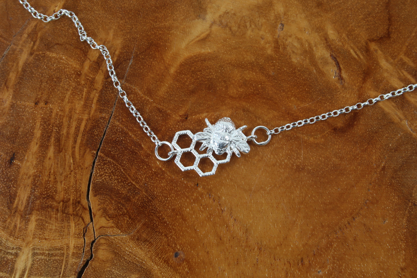 Silver Bee on open honeycomb necklace