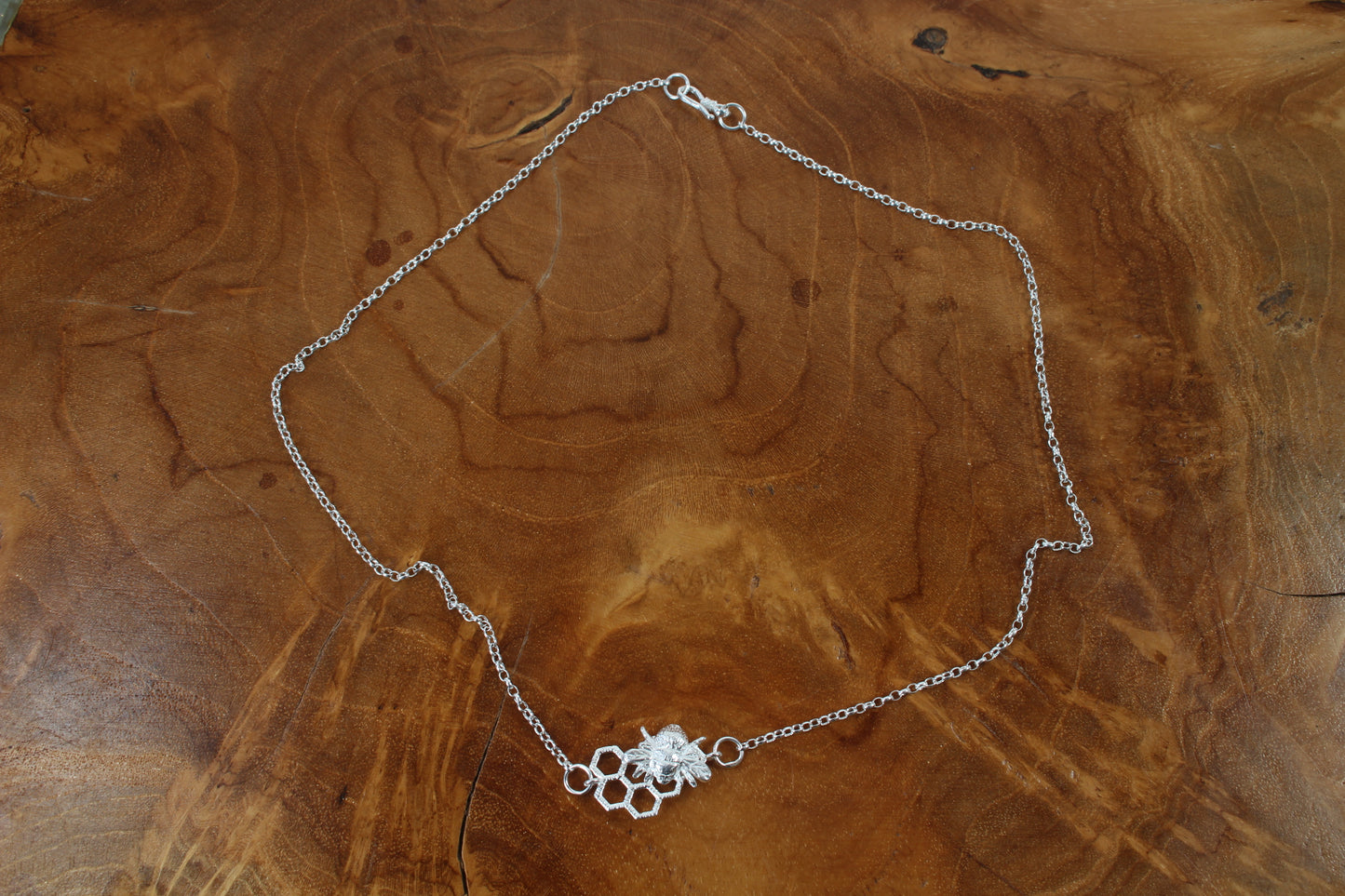 Silver Bee on open honeycomb necklace