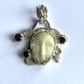 Face Pendant in Carved Bone With Silver & Red Garnet