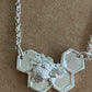 Silver Bee on solid honeycomb necklace