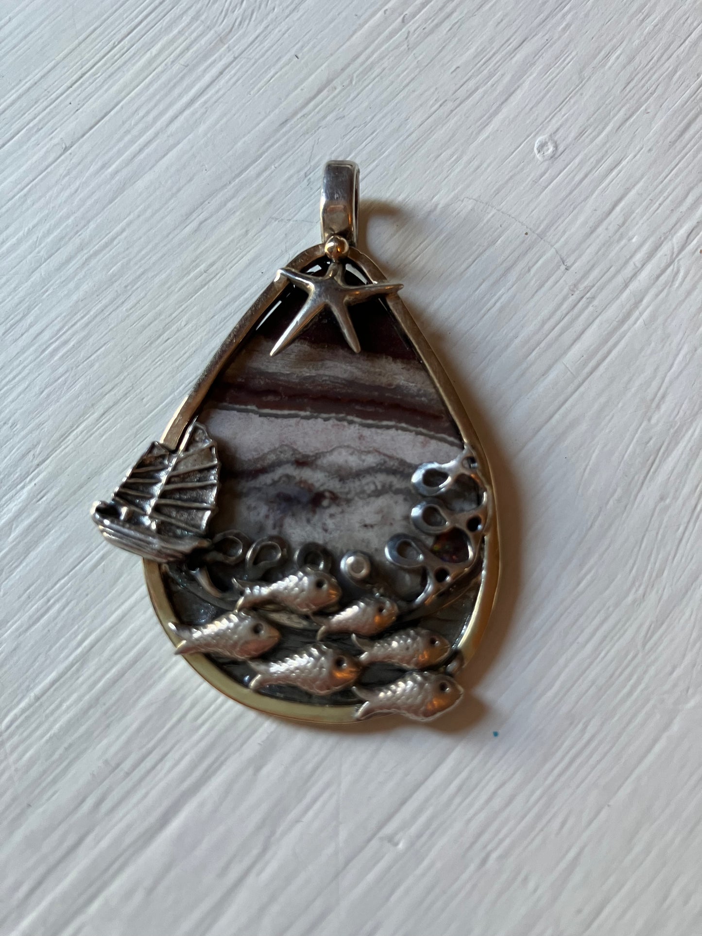 Fish Shoal with boat and star pendant