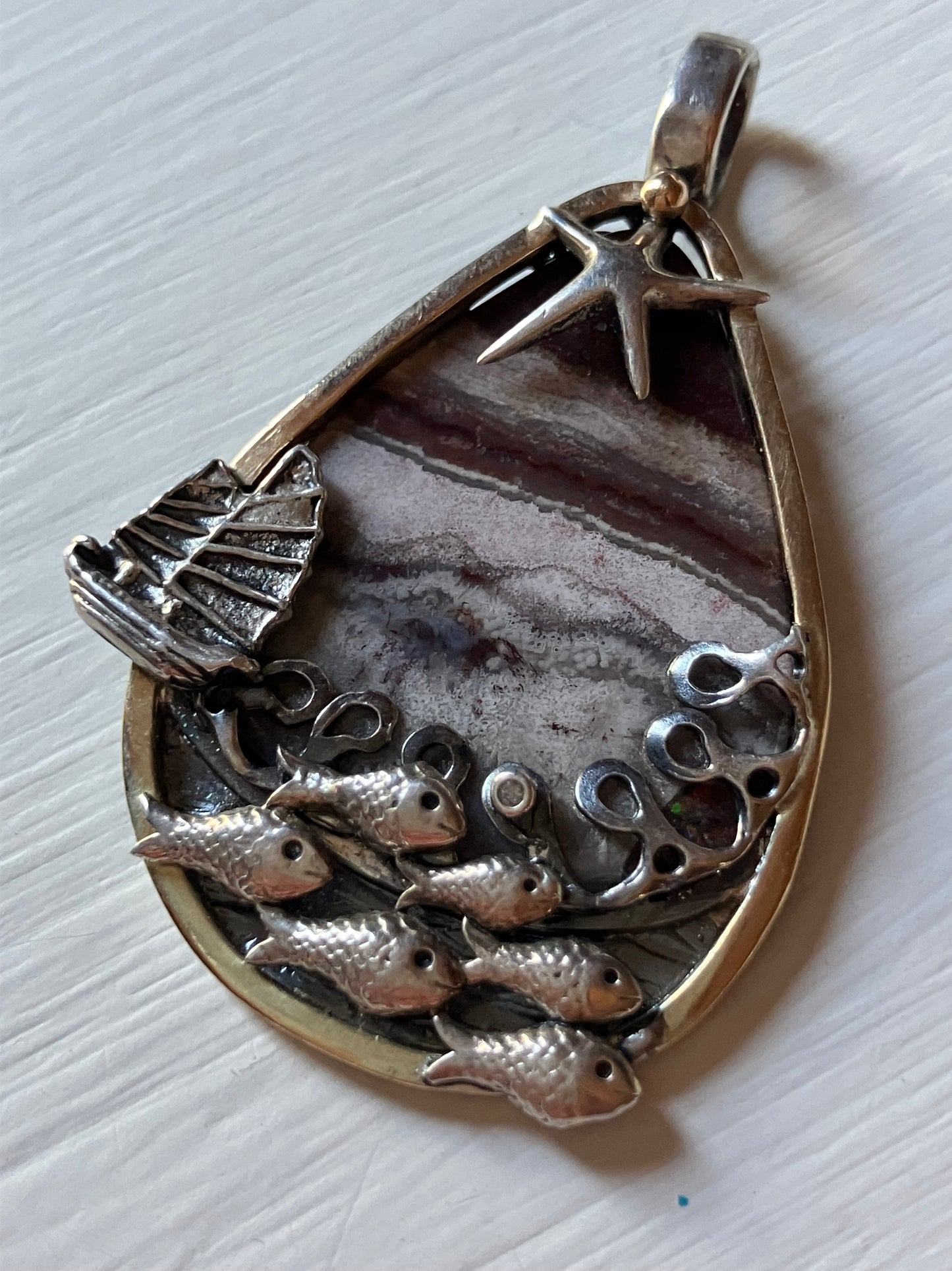 Fish Shoal with boat and star pendant