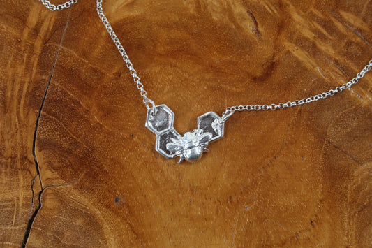 Silver Bee on solid honeycomb necklace