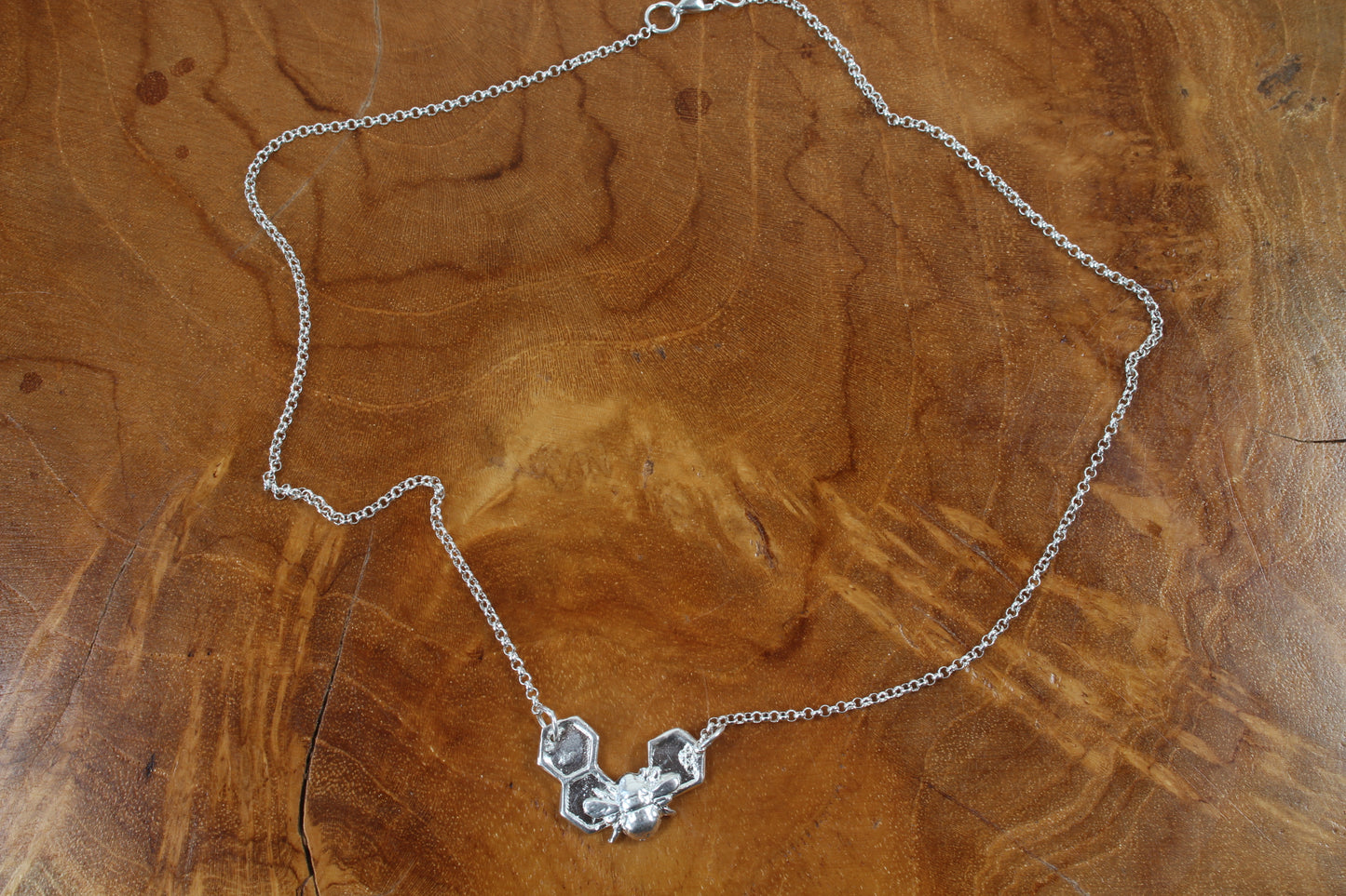 Silver Bee on solid honeycomb necklace